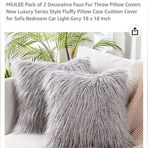 Miulee pack of 2 decorative faux fur pillow covers with inserts.